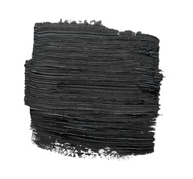 Photo of Brushstrokes of black oil paint on white background, top view