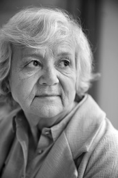 Photo of Portrait of elderly woman on blurred background. Black and white effect
