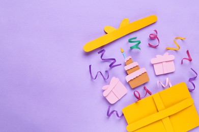 Photo of Birthday party. Paper cake, gifts and confetti on lilac background, flat lay with space for text