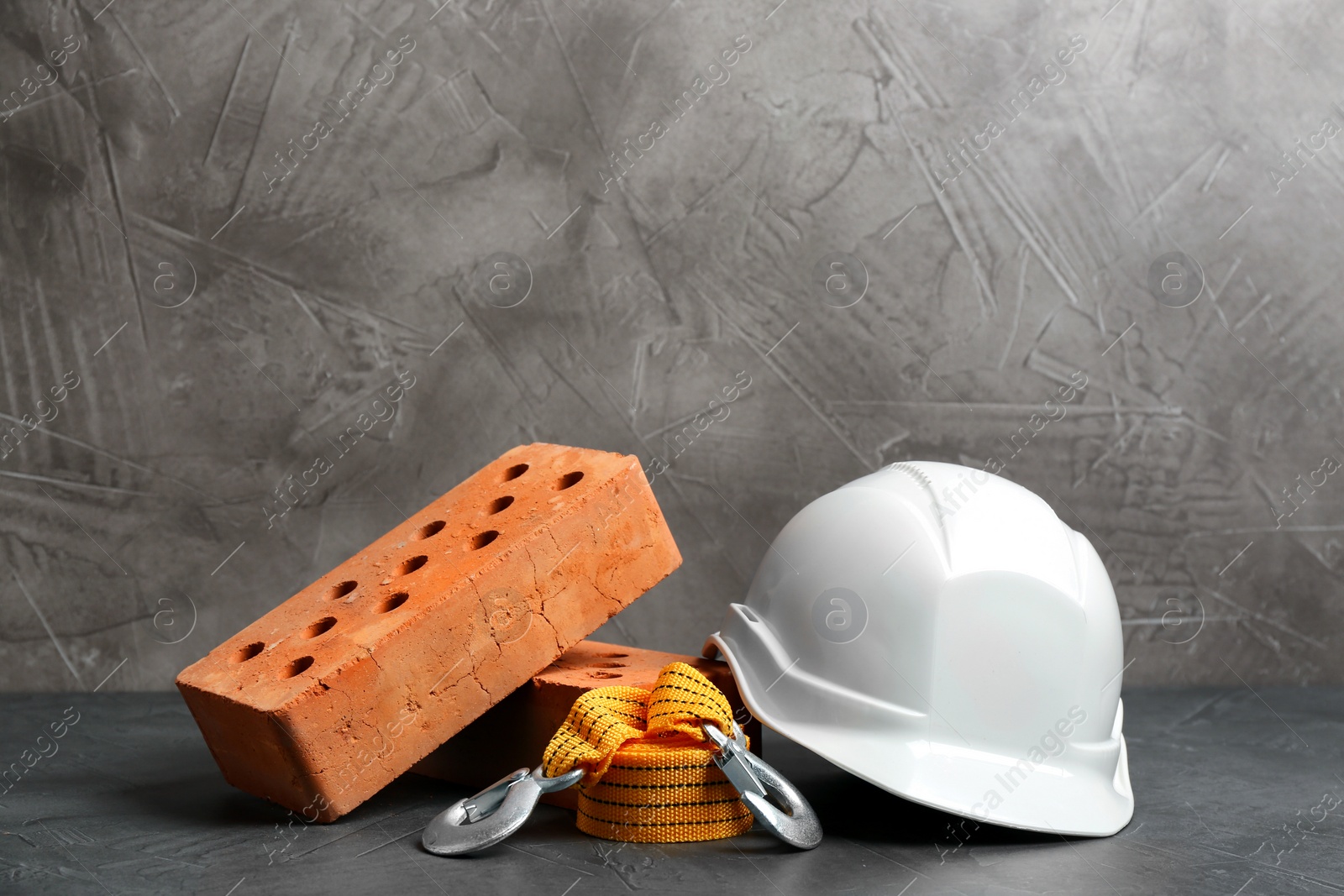 Photo of Composition with construction tools on grey table, space for text