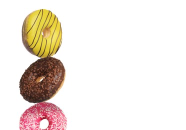 Image of Three different tasty donuts on white background