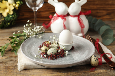 Photo of Festive Easter table setting with beautiful floral decor