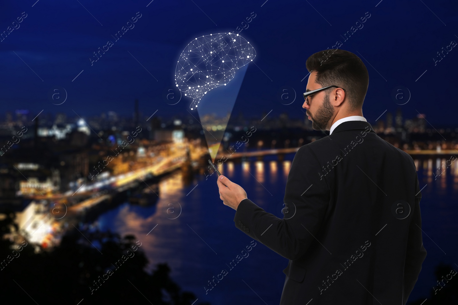 Image of Young man using smartphone with virtual image of brain and night cityscape on background. Machine learning concept 