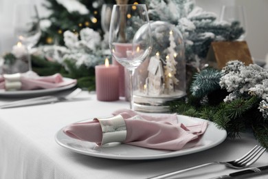 Beautiful festive table setting with Christmas decor indoors