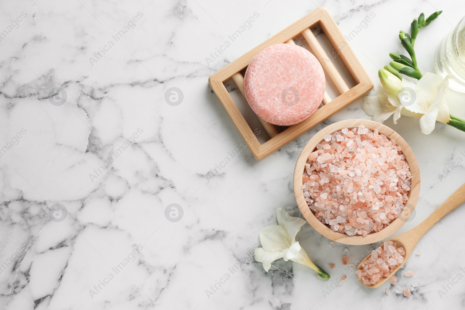 Photo of Flat lay composition with different spa products on white marble table. Space for text