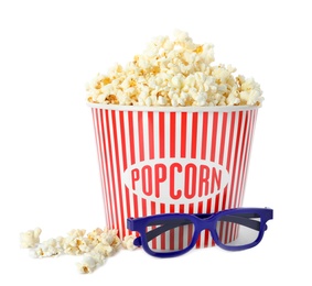 Photo of Bucket of fresh popcorn and 3D glasses on white background. Cinema snack