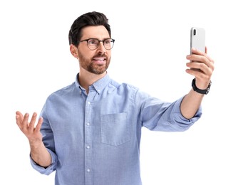 Photo of Smiling man taking selfie with smartphone on white background