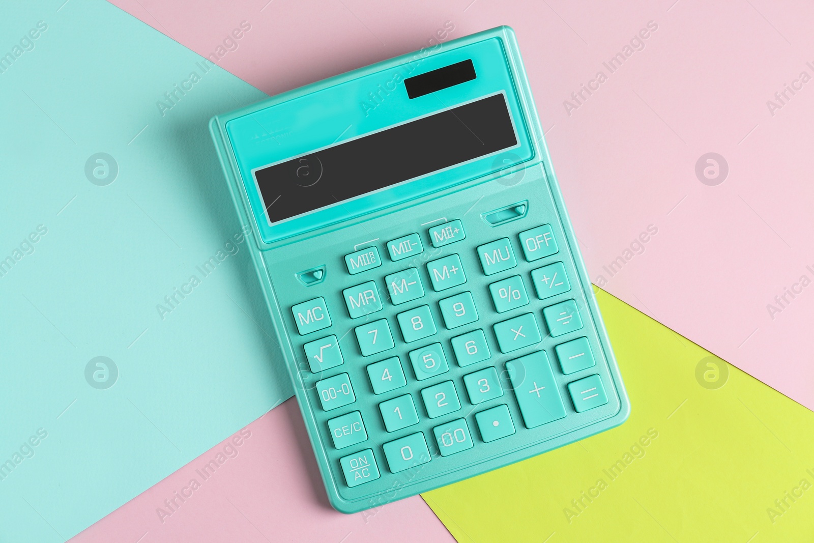 Photo of Modern calculator on color background, top view