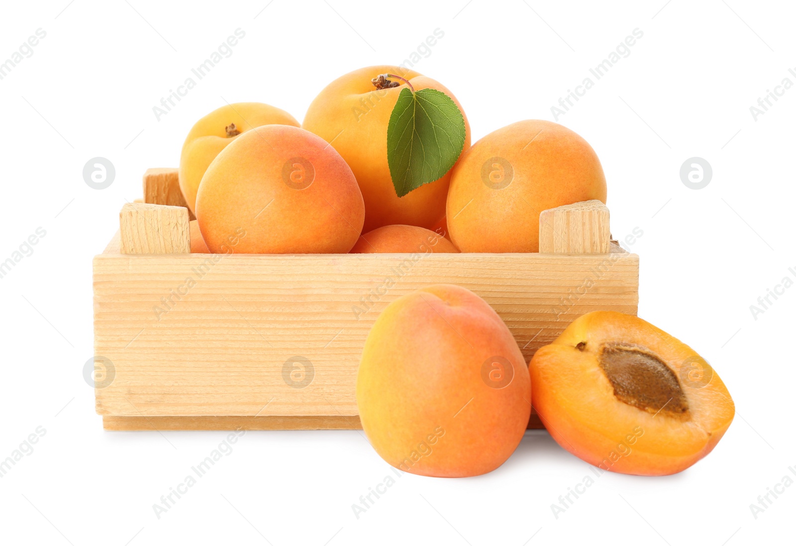 Photo of Wooden crate of delicious ripe sweet apricots isolated on white