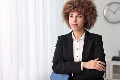 Beautiful female notary with clipboard in office, space for text