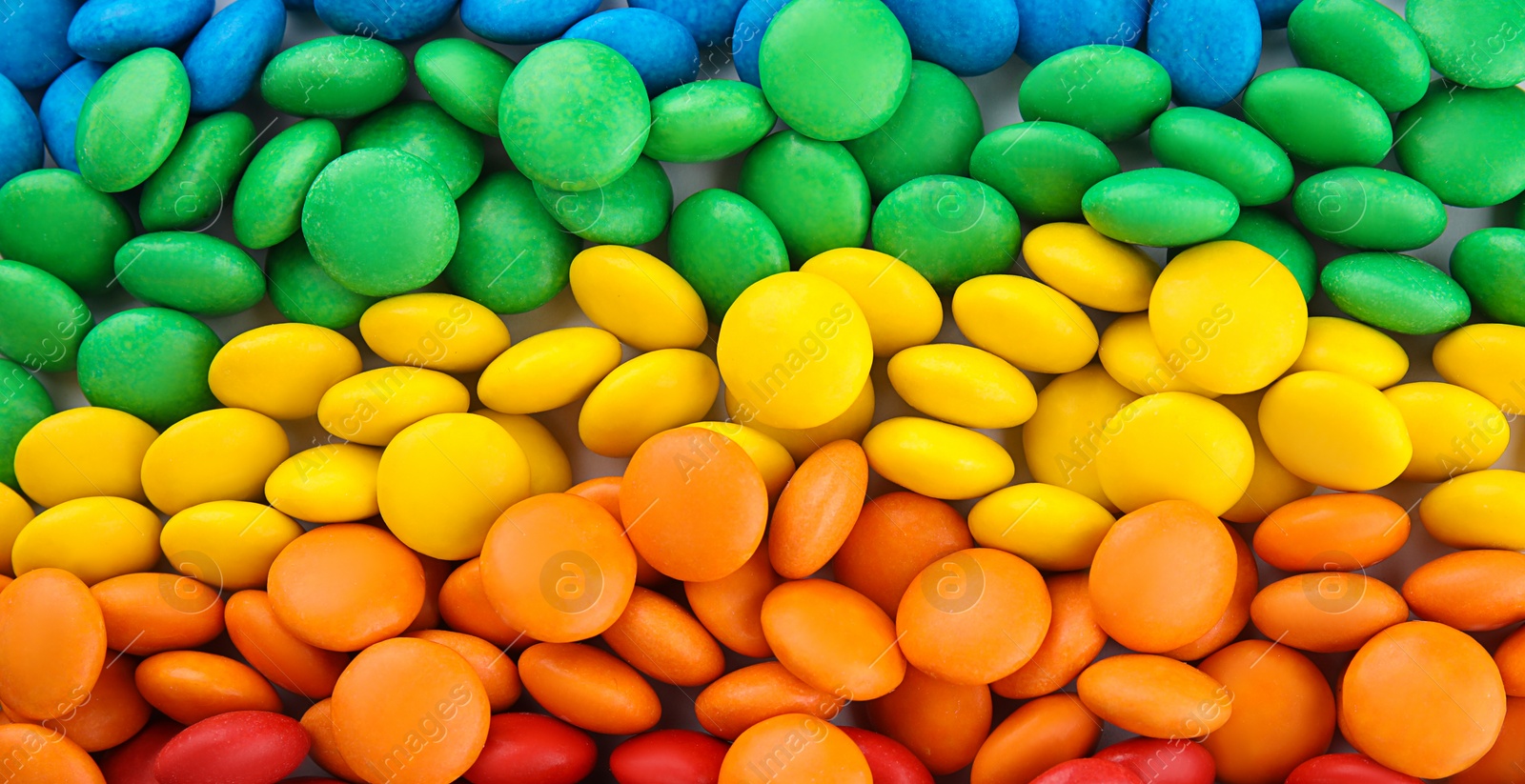 Image of Many colorful candies as background, top view. Banner design 