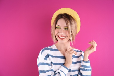 Photo of Beautiful young woman posing on color background. Summer fashion