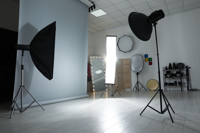 Photo of Interior of modern photo studio with professional equipment