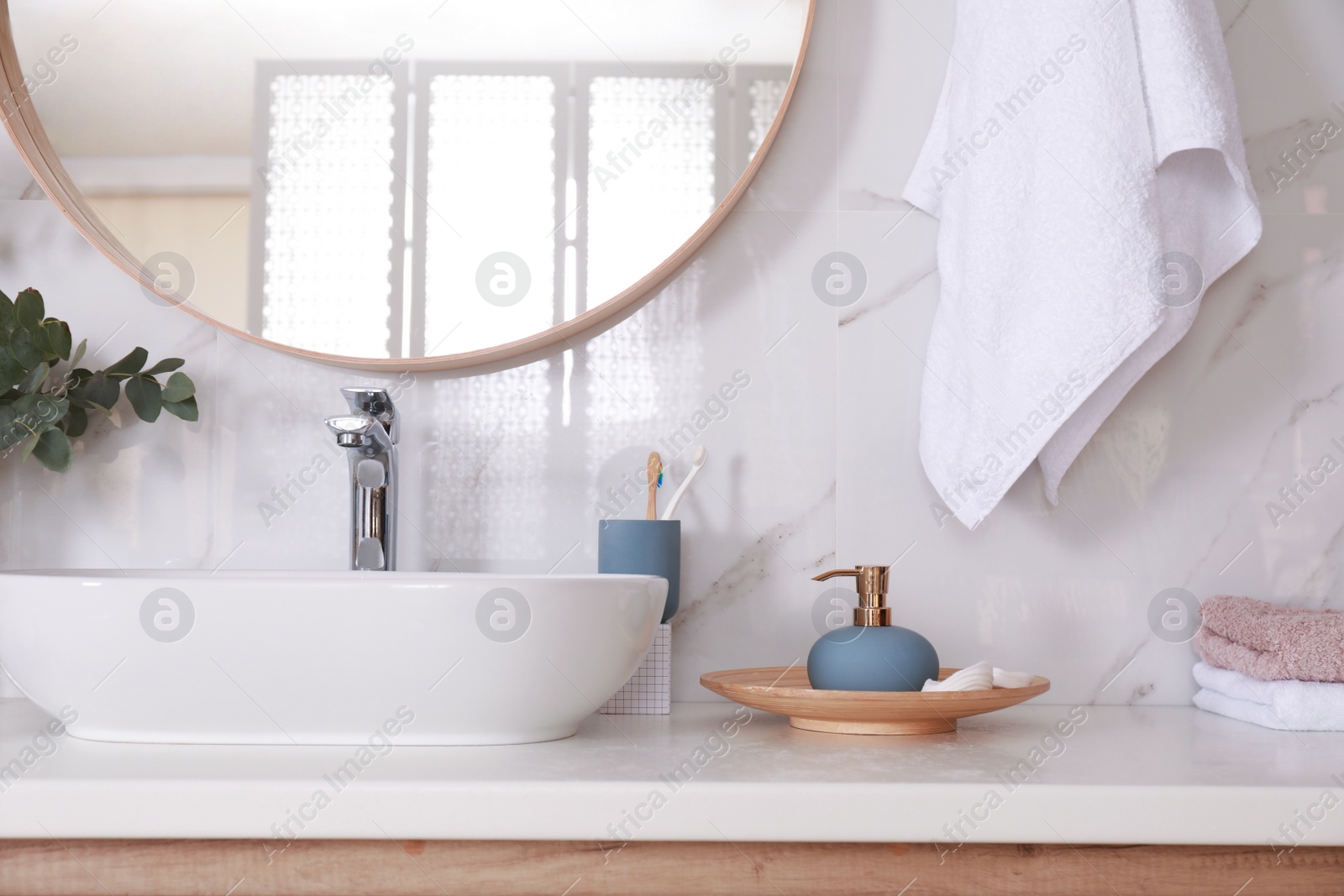 Photo of Stylish bathroom interior with vessel sink and decor elements