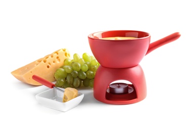 Composition with pot of delicious cheese fondue on white background