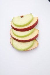 Slices of ripe apples isolated on white, top view