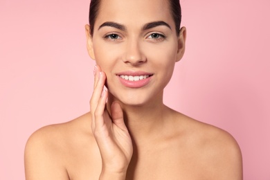 Photo of Portrait of beautiful young woman on color background. Lips contouring, skin care and cosmetic surgery concept