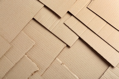 Photo of Pieces of cardboard as background, top view. Recycling concept