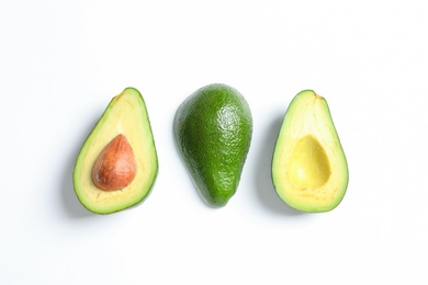 Composition with ripe fresh avocados on white background