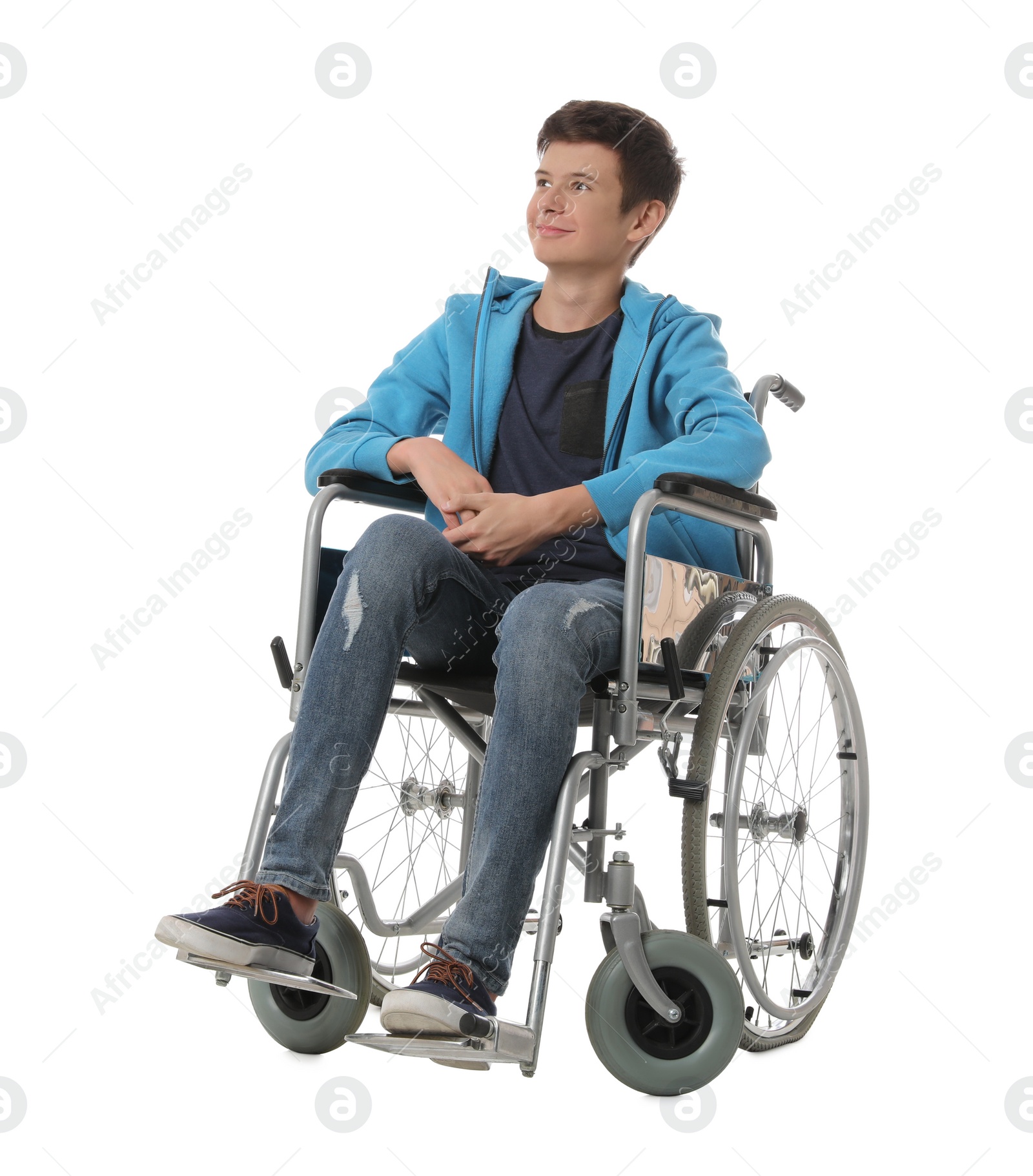 Photo of Teen boy in wheelchair on white background