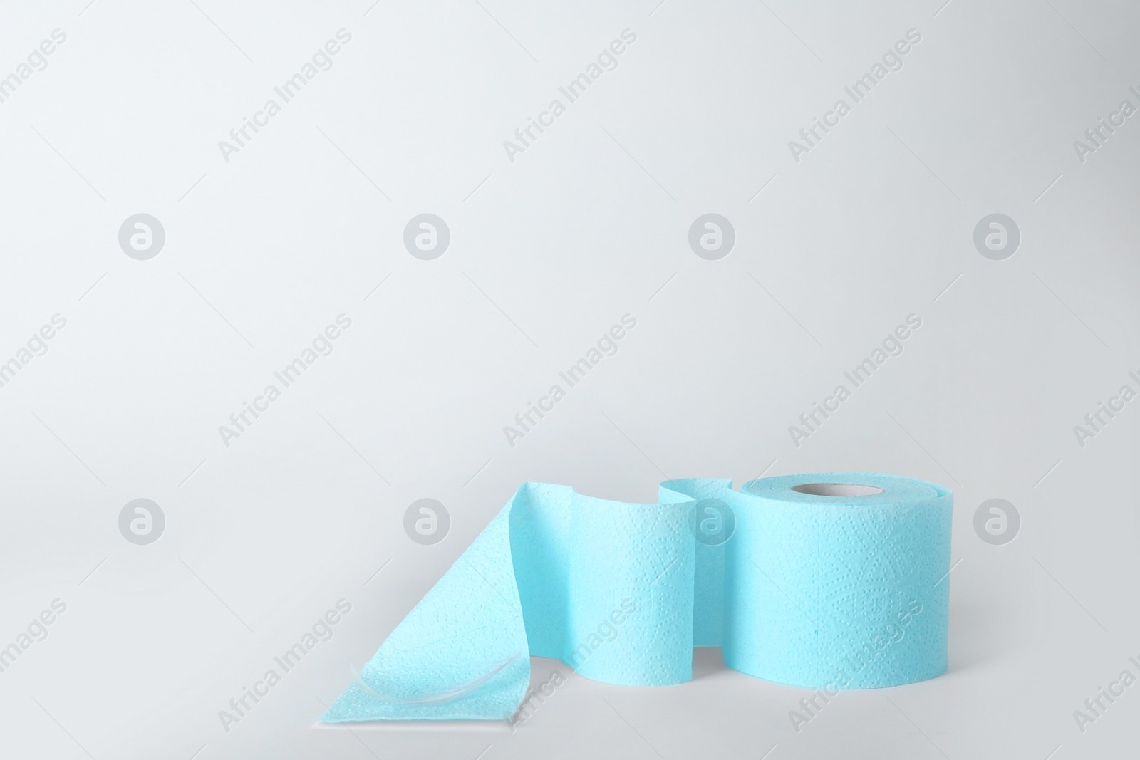 Photo of Roll of toilet paper on white background. Space for text