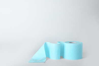 Photo of Roll of toilet paper on white background. Space for text