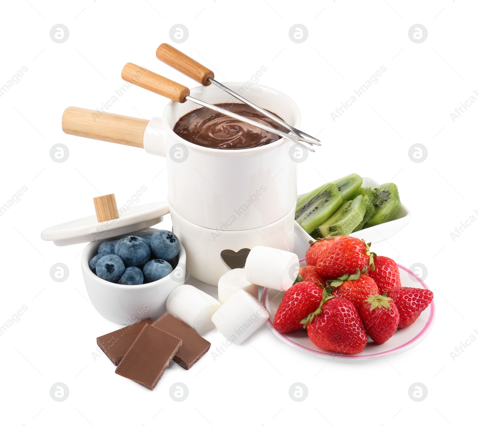 Photo of Fondue pot with melted chocolate, fresh berries, kiwi, marshmallows and forks isolated on white