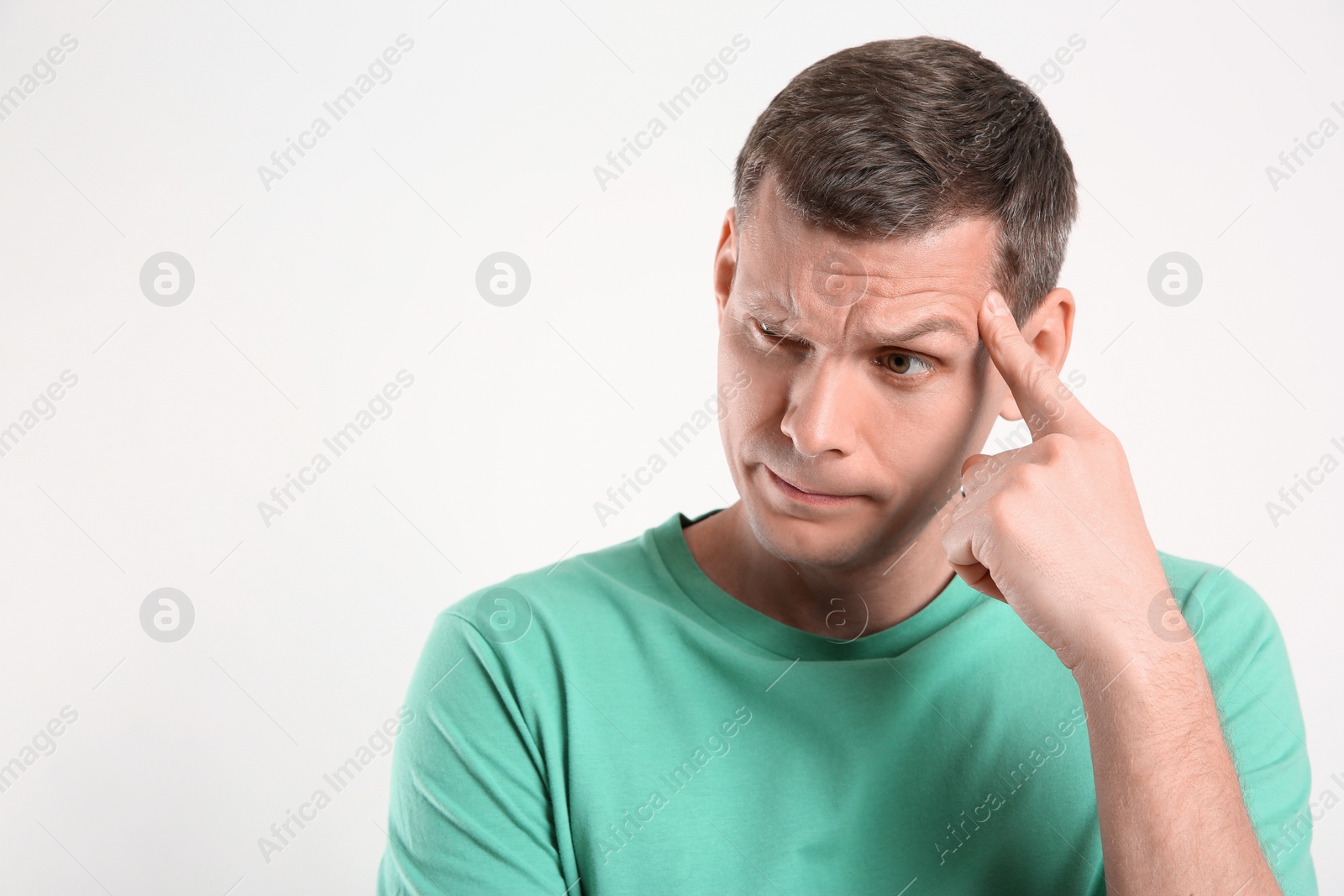 Photo of Emotional man in casual outfit on white background