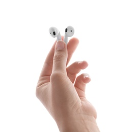 Photo of Woman holding modern wireless earphones on white background, closeup