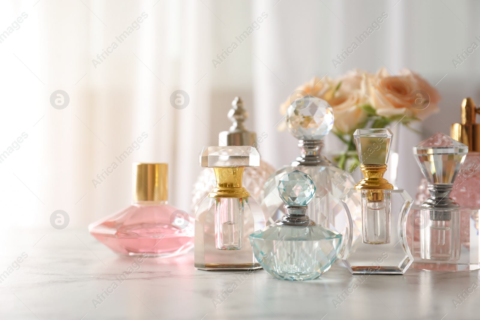 Photo of Many different perfume bottles on dressing table, space for text