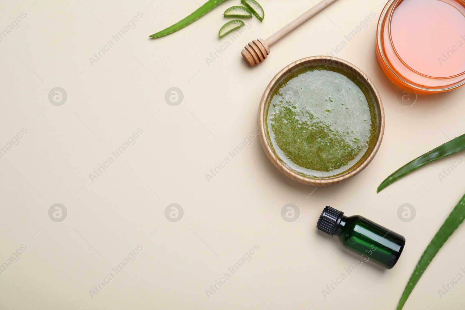 Photo of Homemade hair mask and ingredients on beige background, flat lay. Space for text