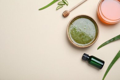 Homemade hair mask and ingredients on beige background, flat lay. Space for text