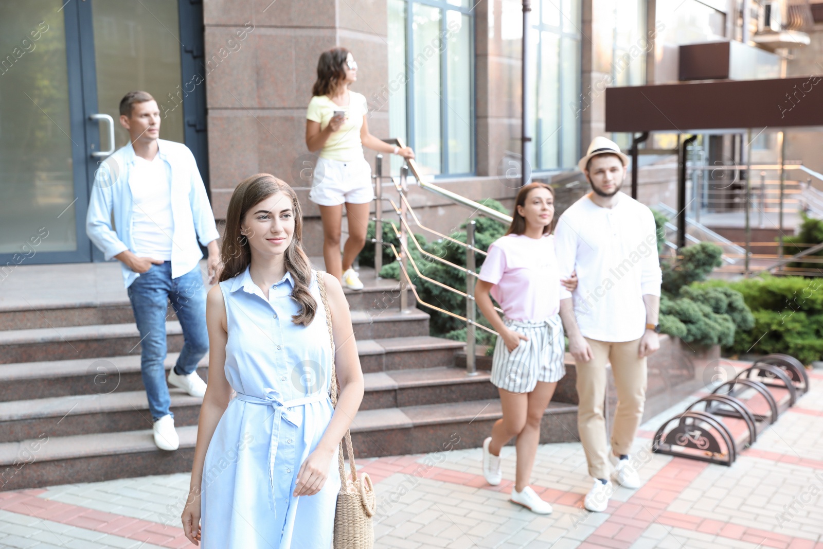 Photo of Beautiful woman walking on modern city street