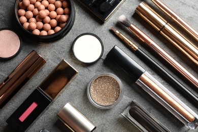 Photo of Set of luxury makeup products on grey background, flat lay