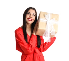 Photo of Woman in red dress holding Christmas gift on white background