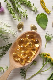 Photo of Spoon of pills, different herbs and flowers on white wooden table, flat lay. Dietary supplements