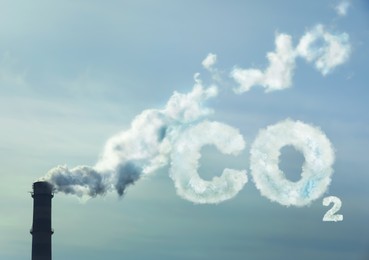 Image of Inscription CO2 made of smoke. Polluting air from industrial chimney outdoors 