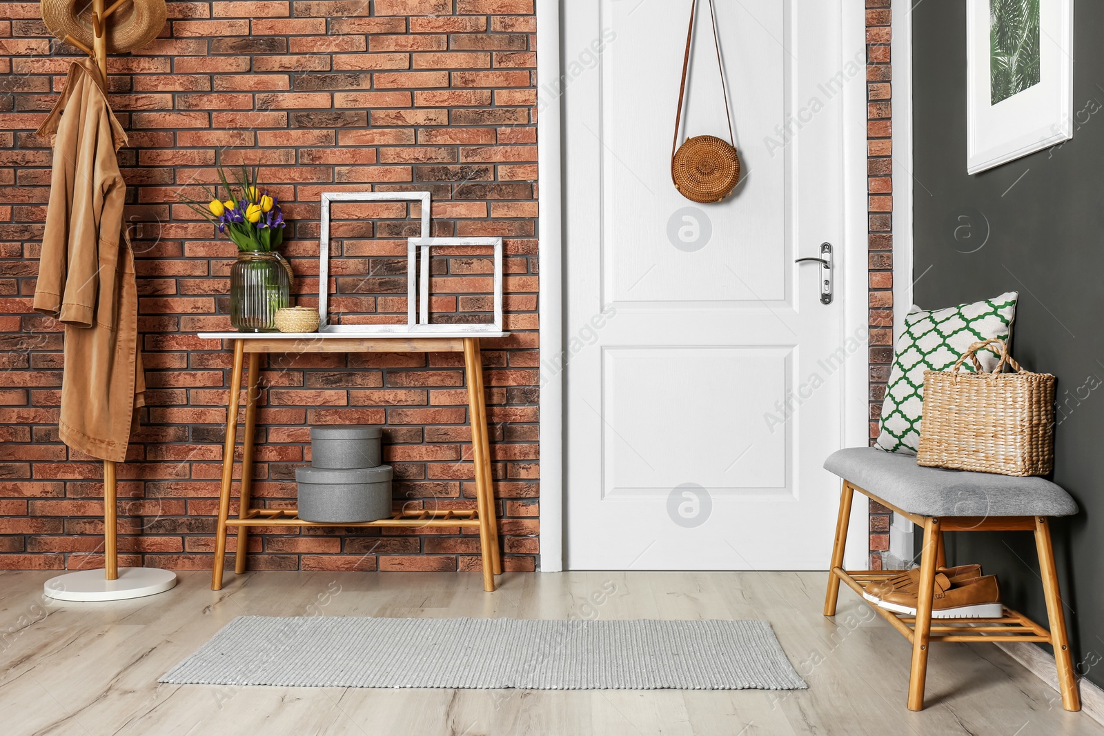 Photo of Hallway interior with stylish table and bench