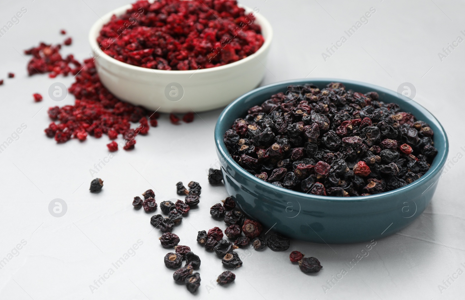 Photo of Dried black and red currant berries on light table