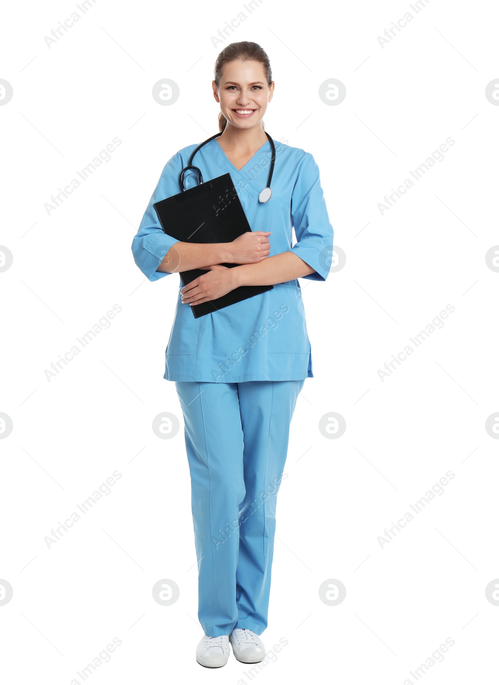 Photo of Full length portrait of young medical assistant with stethoscope and clipboard on white background