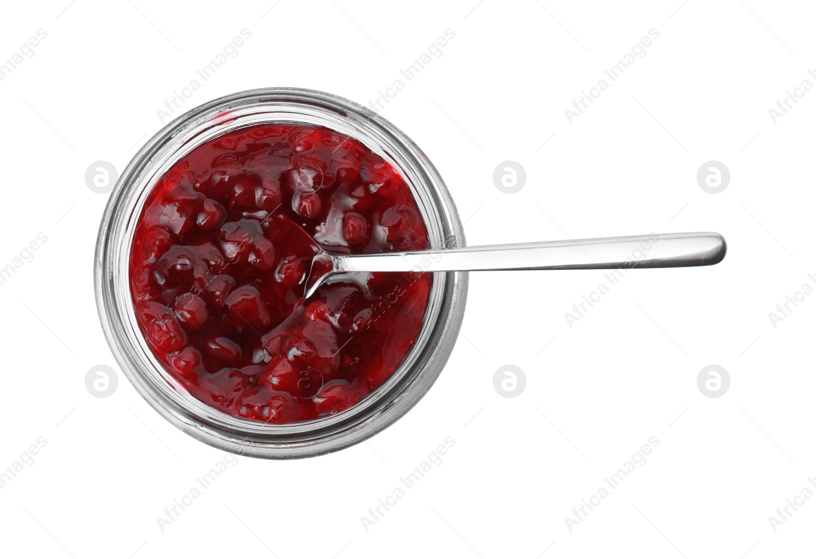 Photo of Fresh cranberry sauce in glass jar and spoon isolated on white, top view