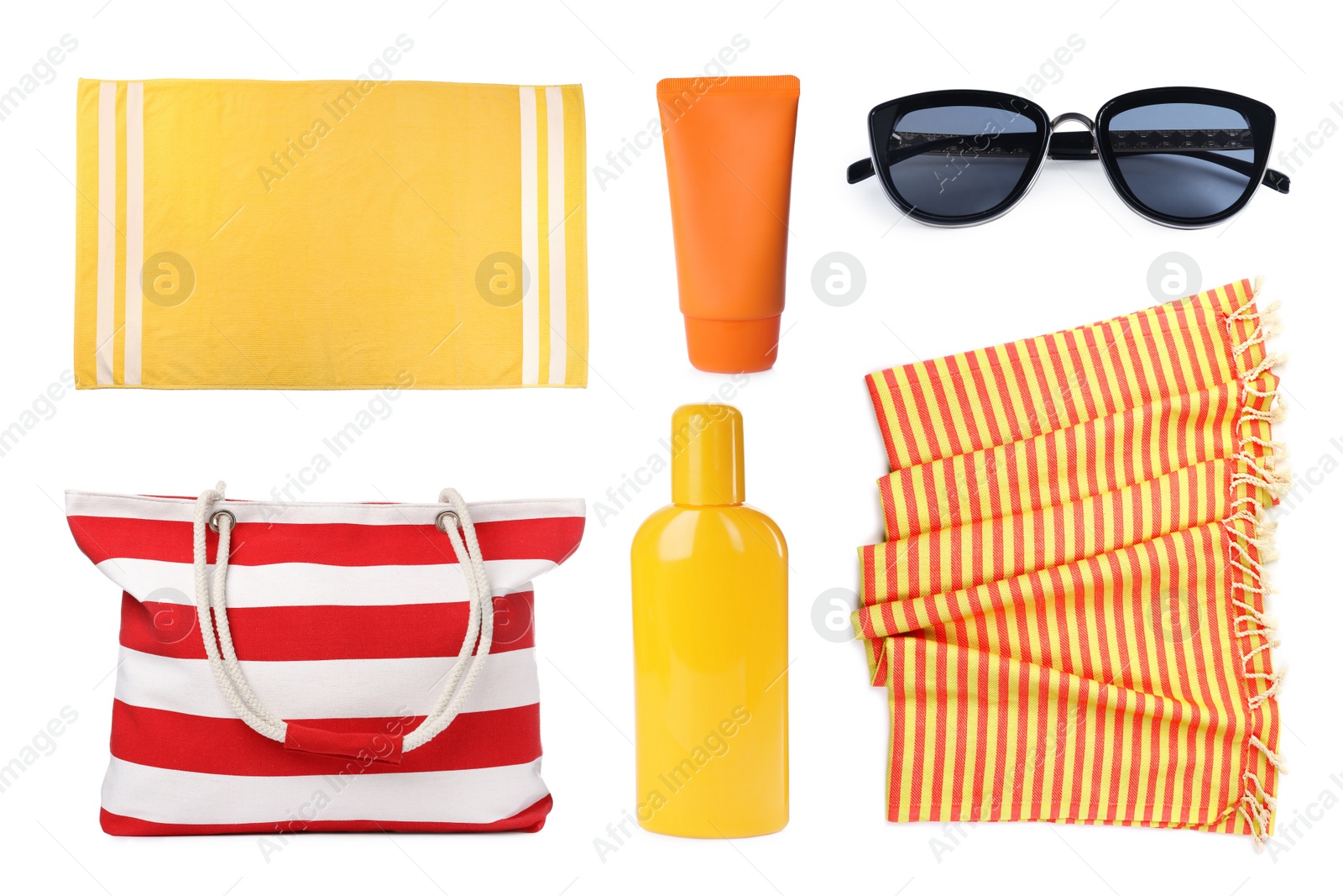 Image of Set with towels and other beach accessories on white background