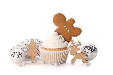 Tasty cupcake with gingerbread man and Christmas decor on white background