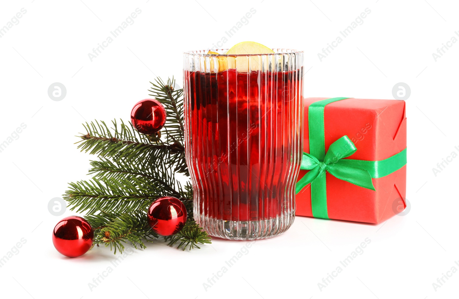 Photo of Aromatic Sangria drink in glass and Christmas decor isolated on white
