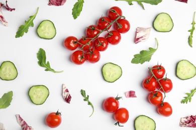 Photo of Fresh vegetables for salad on white background, top view