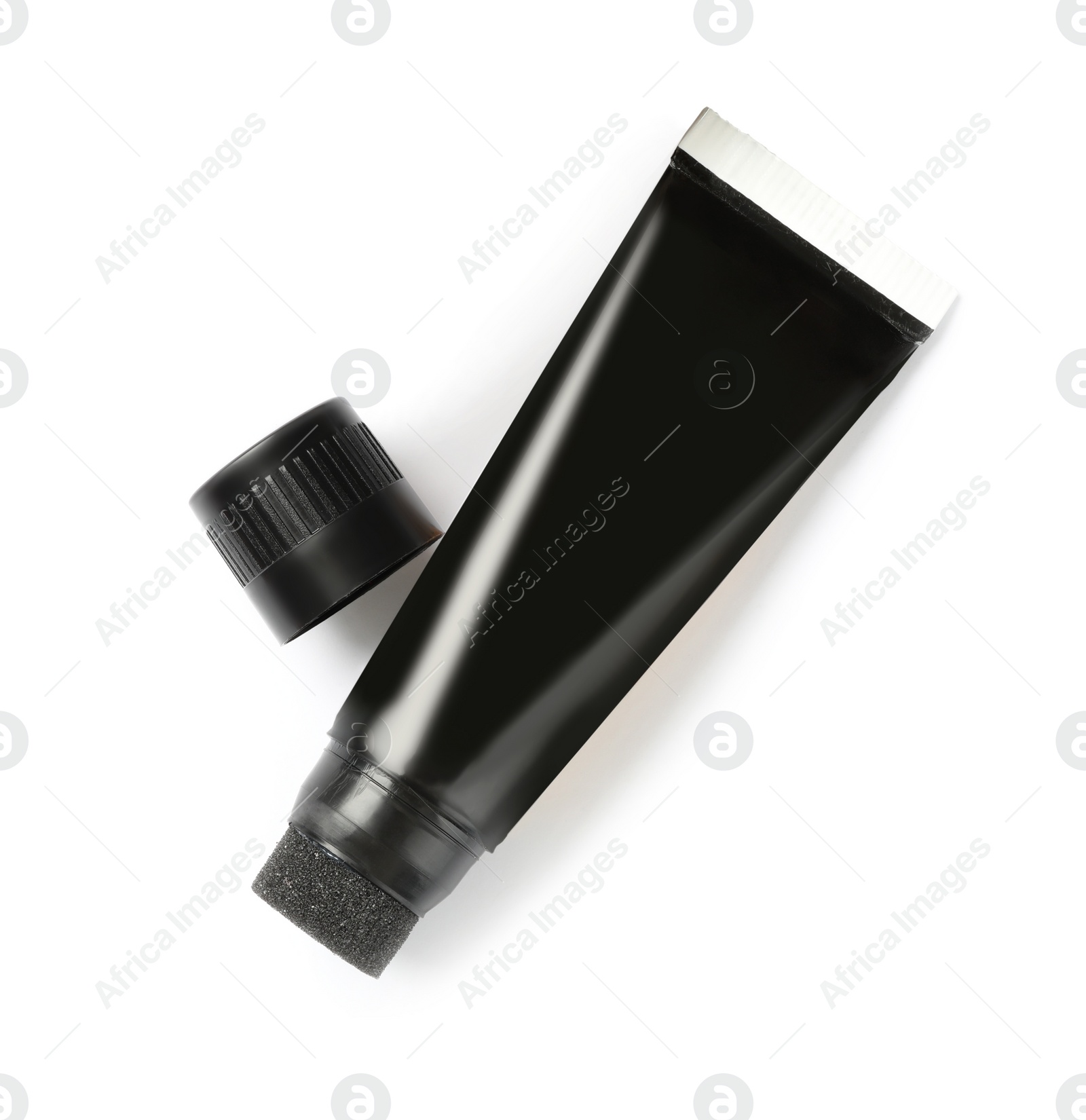 Photo of Tube of shoe care product on white background, top view