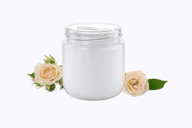 Photo of Jar of hand cream and roses on white background