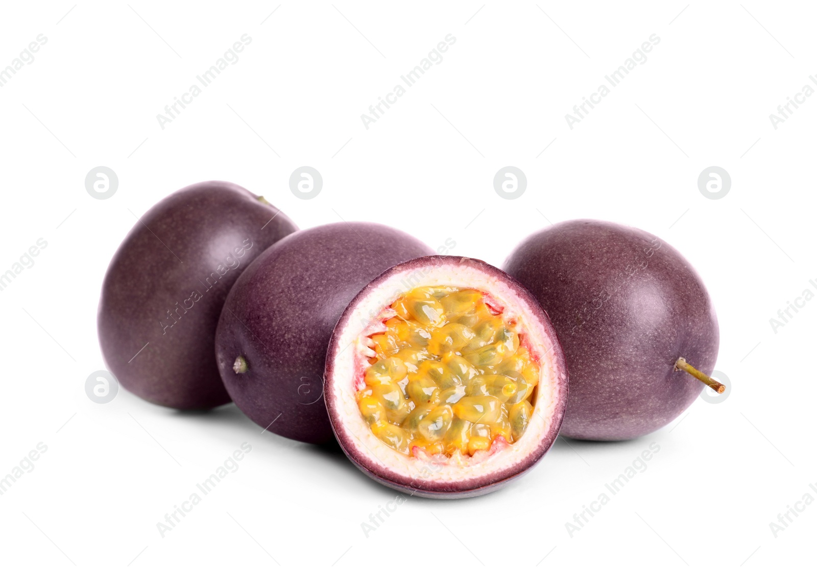 Photo of Cut and whole passion fruits on white background