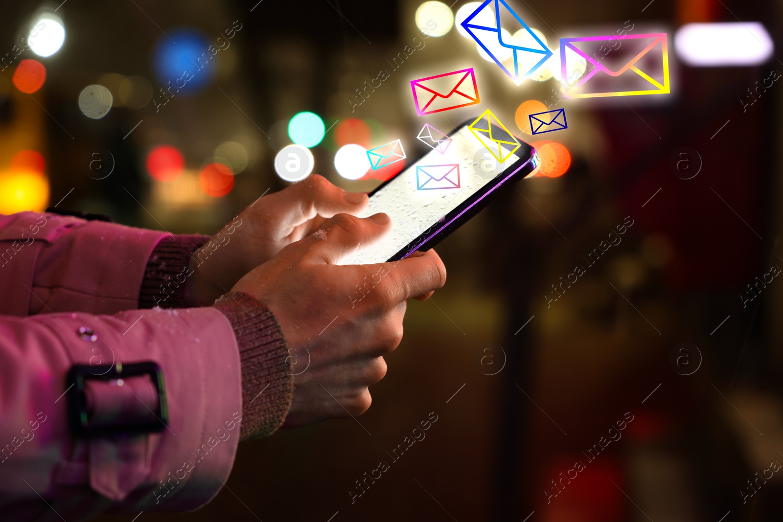 Image of Man with smartphone chatting outdoors, closeup. Many illustrations of envelopes as incoming messages out of device