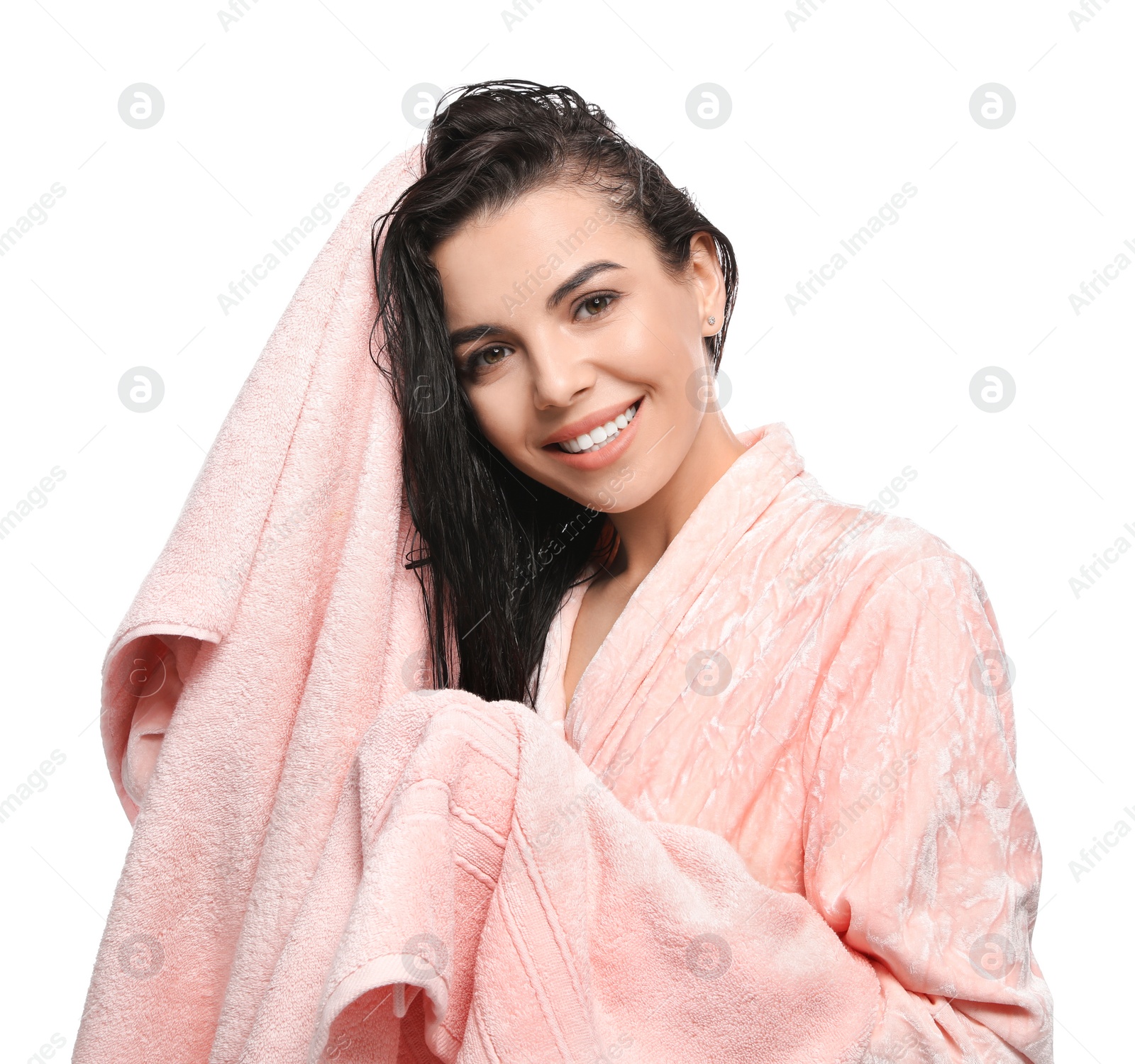 Photo of Happy young woman drying hair with towel after washing on white background